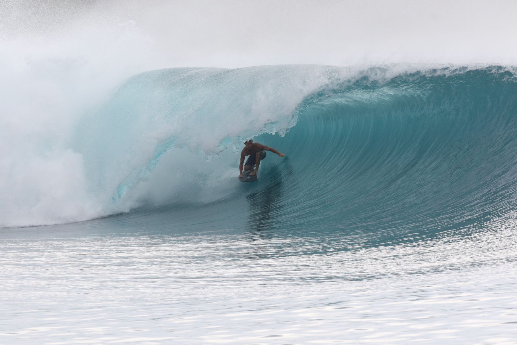 Surfer deep in a Greenbush barrel